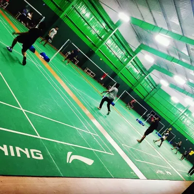 While you're here for dance, you'll see that our home is a bustling badminton academy. This professional sports environment is what allows us to offer such a large, high-ceiling space for our fitness classes.