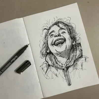I love capturing pure joy. This pen sketch of a laughing child is one of my favorites. It's all about the expression.