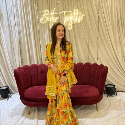 Dressed up for a wedding function. I love the elegance and vibrant colors of traditional Indian wear, and this yellow sharara set was perfect for the celebration.