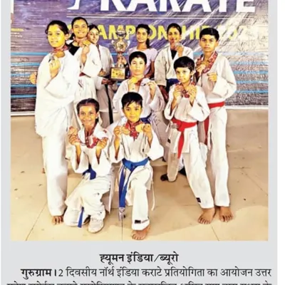 A proud moment for Sai Karate Academy featured in the newspaper, showing our team of young champions with their trophy and medals after the North India Karate competition.