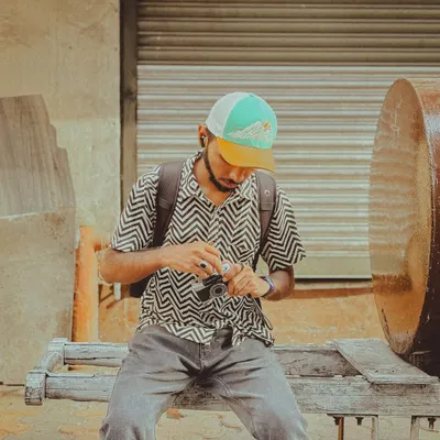 A shot of me on World Photography Day, checking my camera between takes. This image represents my seven-year journey behind the lens and my passion for capturing the stories hidden in plain sight.