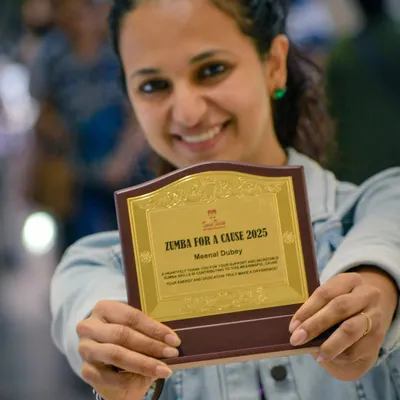 Holding this plaque from a "Zumba for a Cause" event feels like holding love. We did this fundraising event for underprivileged children, and I'm so grateful for everyone who contributed.