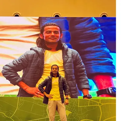 On stage, in my element. Whether I'm on the screen or in front of the crowd, my mission is the same: to spread happiness and get everyone moving. This was from a large corporate town hall.