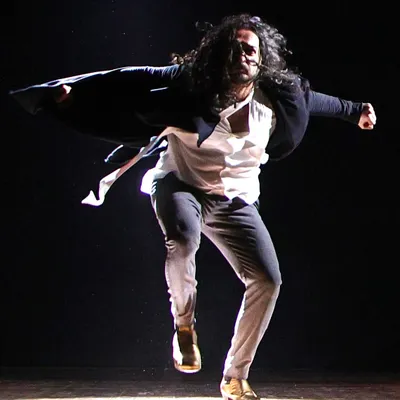 The artist's life captured in a single moment: the stage, the haze, and the spotlight. This is me in my element, completely lost in the dance.