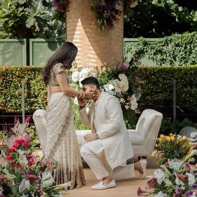 A beautiful, tender moment from an engagement ceremony we designed. The decor was not only beautiful but also sustainable, with a hand-woven backdrop and locally sourced flowers, creating a truly mindful celebration.