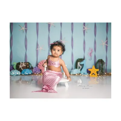 Shell we admire this cuteness? This little mermaid is ready for her underwater adventure in this creative sitter session.