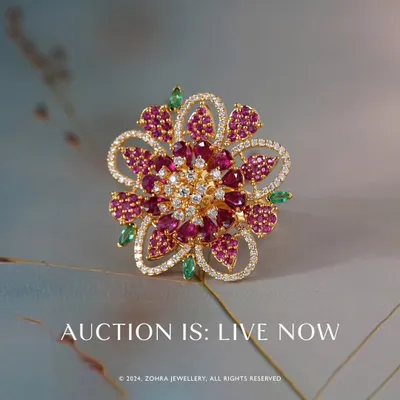The 'Fluttering Whisper' ring, the showstopper of my recent auction. This magnificent floral design is crafted in 18k gold and features exquisite Mozambique rubies, pristine Zambian emeralds, and radiant premium diamonds. It is a testament to what is possible with bespoke design.