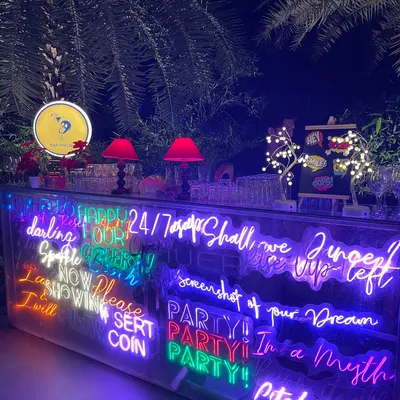 A full view of the custom neon bar I designed for a private birthday party. The bright, overlapping text creates a dynamic and modern focal point for the celebration.