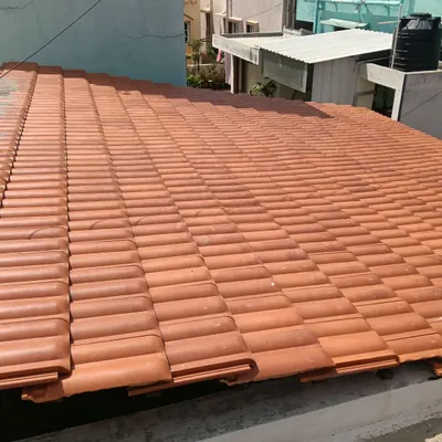 In addition to garden structures, we also handle roofing projects like this one. Here, we have installed classic Mangalore tiles on a sloped roof, providing a durable and traditional roofing solution.