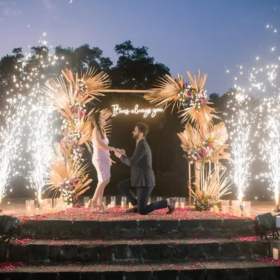 A cinematic moment with cold pyros erupting as he gets down on one knee. We time every element to create a truly unforgettable and grand proposal experience.