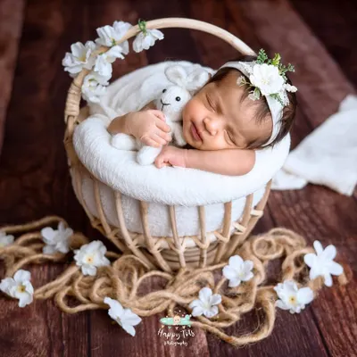 This peaceful pose took a lot of patience, but it was so worth it. We gently guide babies into comfortable positions, like this sweet head-on-hands pose in a rustic basket.