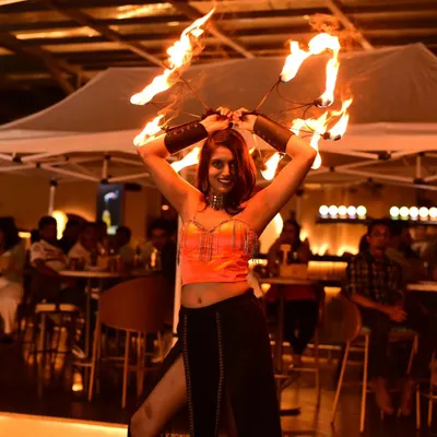 A fiery moment from an Oktoberfest celebration. Using fire fans allows me to get close to the audience and share the warmth and energy of the performance.
