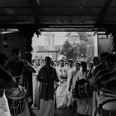 An artistic shot from a temple performance, capturing the timeless atmosphere of a traditional Chendamelam procession.
