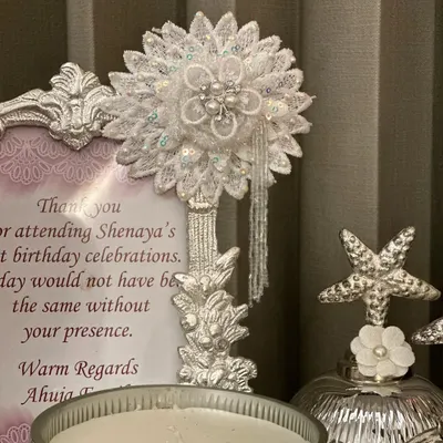 An evening of light and fragrance. Our handcrafted hampers are more than gifts, they are experiences, featuring beautiful decor pieces like this lace flower and scented candle.