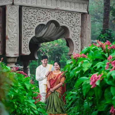 A beautiful pre-wedding shoot at Elements Bangalore, where the couple's traditional South Indian attire is perfectly framed by lush greenery and classic architecture.