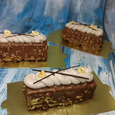 Beautifully crafted Hazelnut Mousse pastries from our international cakes class. Learn to create these layered desserts with a crunchy base, smooth mousse, and elegant toppings.