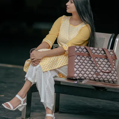 Modeling a stylish and functional laptop bag from Zouk. The pose is natural and confident, showing how the bag fits into a modern, on-the-go lifestyle.