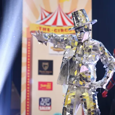 Our Silver Mirror Man strikes a pose at a circus-themed event. This act is designed to impress guests and get the party started.