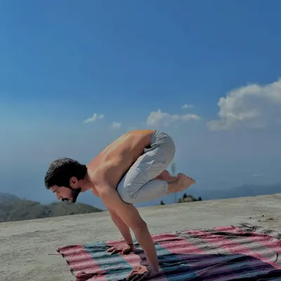 My personal practice, like this Bakasana (Crane Pose) in the mountains, is my foundation. It connects me to the principles of balance, strength, and mindfulness.
