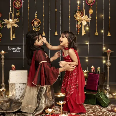 The playful bond between sisters is so special. This candid moment of laughter during their Diwali photoshoot is a memory they will cherish forever.