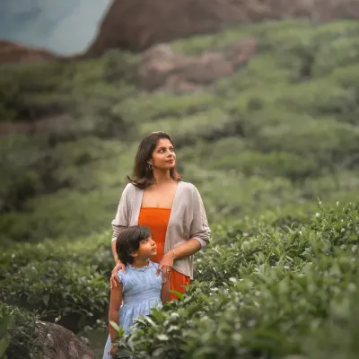 In the rolling tea gardens of Munnar, I captured this beautiful moment between Nina and her daughter Tara. Outdoor shoots allow us to use stunning landscapes as the canvas for your family's story.