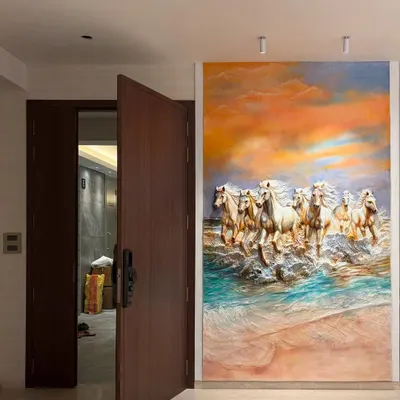 This large, colorful 7 horses mural is installed in a bedroom, creating a stunning feature wall. The artwork's energy and vibrant sunset colors make the room feel expansive and powerful.