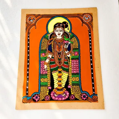 A full-figure painting of the goddess Andal holding a parrot, a symbol of her devotion. This 13x12 inch piece is filled with traditional patterns and makes a beautiful, meaningful gift.