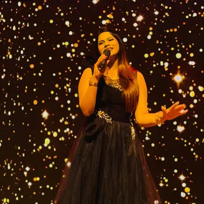 Commanding the stage in a beautiful gown against a sparkling backdrop. For gala nights and award functions, I bring an element of glamour and professionalism to match the occasion.