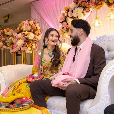 A happy moment between the couple during their Kurmai and Chunni ceremony. We handle the food and service so families can focus on these precious moments.