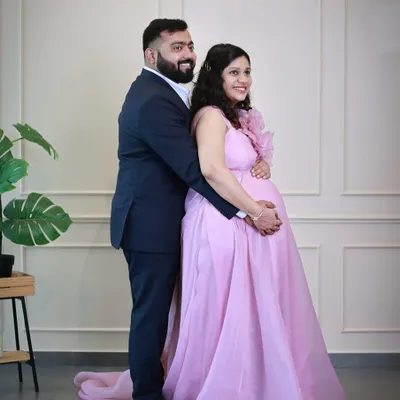 Our lavender organza gown is pure romance. It features a large, handcrafted statement flower on the shoulder and a light, airy skirt that flows beautifully.