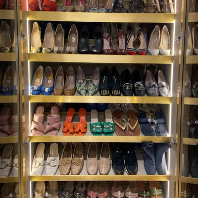 A shoe collection transformed into a work of art. With integrated lighting and ample shelving, every pair is on display, making it easy to find the perfect match for any outfit. This is what a shoe lover's dream looks like.