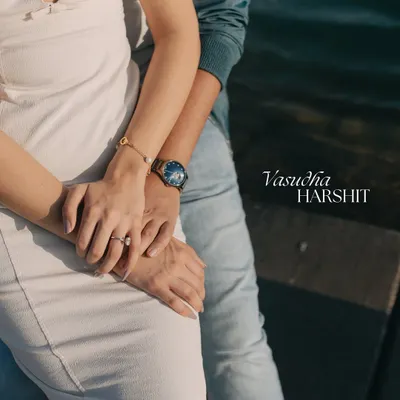 A pre-wedding shoot is about capturing the beginning of your forever. This close-up on the couple's hands, set against the stunning backdrop of Qatar, symbolizes their new journey and intertwined lives.