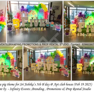 A cheerful Peppa Pig theme for a fifth birthday in an apartment clubhouse. The setup includes a vibrant rainbow balloon arch, a grass-like floor, and a large "FIVE" table surrounded by Peppa Pig characters.