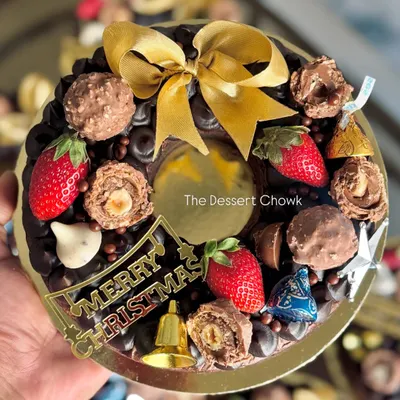 My Christmas Edition Brownie Wreath. It's a rich, fudgy brownie base decorated with chocolates, strawberries, and festive toppers, making it a perfect centerpiece for your holiday table.