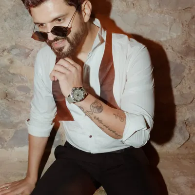 A stylish look for an evening event, featuring a white shirt and a bow tie. Ready to shine bright and bring the energy.