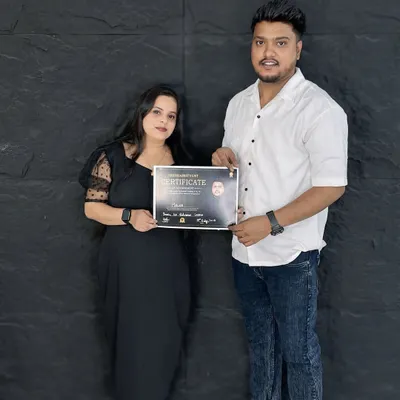 Another happy student receiving her certificate after completing the hairstyling course. It's so rewarding to see my students ready to take on the world.