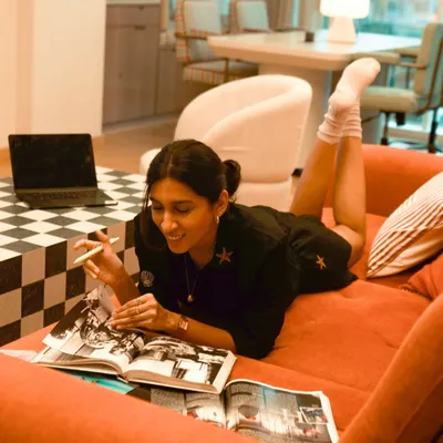 A typical day at the studio isn't always glamorous. It's often just me on the couch with my books and laptop, brainstorming ideas in a comfy outfit.