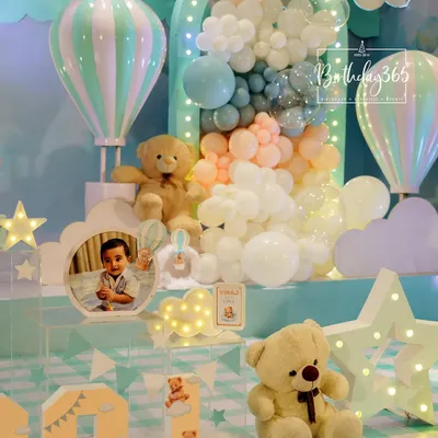 A dreamy hot air balloon and teddy bear theme, perfect for a first birthday. We used a soft, pastel color palette and cloud-like balloon clusters to create a gentle, sky-high celebration.