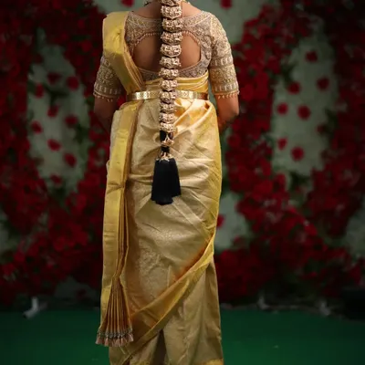 A perfect view of our traditional hair jewellery (jadai billai) on a client. This piece beautifully complements a classic silk saree and completes the South Indian bridal look.