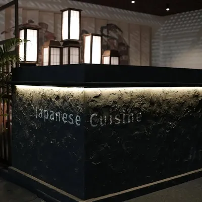 The main counter of the 'Ebisu' Japanese cuisine pop-up at the India Art Fair. We used a textured, dark stone finish with under-counter lighting and traditional Japanese lanterns to create a sophisticated focal point.