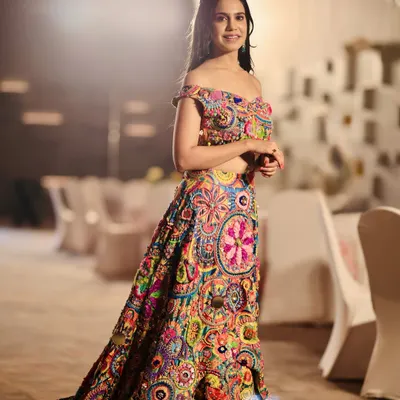 A full view of the stunning and unique multi-colored lehenga by Krupa Jain. This is a perfect example of a statement piece for a vibrant Mehendi or Haldi ceremony.