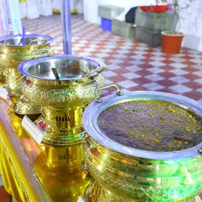 Our dishes are served in beautiful, ornate brass pots that keep the food warm and add a touch of royalty to the buffet line. Here you can see one of our rich, dark gravies.