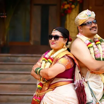 A fun, modern twist on a traditional wedding portrait. We encourage couples to be themselves, and we're always ready to capture those playful, candid moments.
