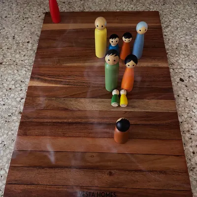 In a typical session, we use a board and figures to represent your family system. This constellation revealed how a client's physical weight was connected to the emotional burden of being the 'giver' in all her relationships, allowing her to release judgments and find peace.