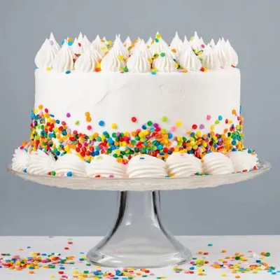 The ultimate party cake. This classic vanilla cake is covered in colourful rainbow sprinkles, making it a fun and festive choice for birthdays of all ages. It's simple, cheerful, and always a hit.