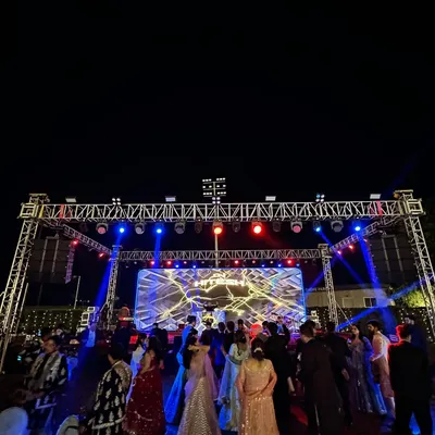 A wide-angle view of the massive stage and lighting rig from a recent wedding. This is the scale of production I bring to make your celebration feel like a music festival.