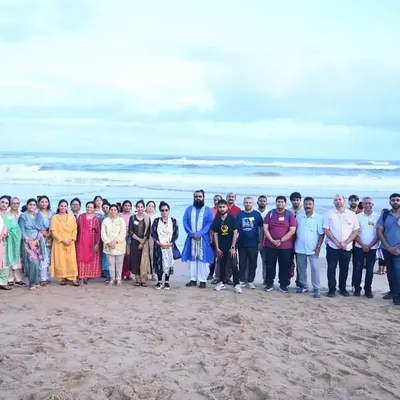 Our group stands together on the shores of the Bay of Bengal in Puri. The vastness of the ocean provides a perfect setting for introspection and feeling connected to the infinite.