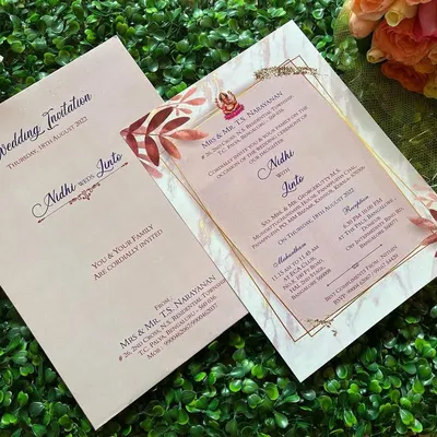 A clean and modern digital invitation design. We can customize these e-invites with your choice of fonts, colors, and motifs to match your wedding theme perfectly.