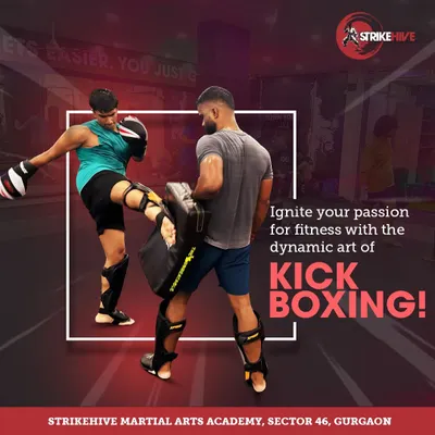 Ignite your passion for fitness with the dynamic art of kickboxing. This image captures a student practicing a powerful knee strike on the pads, a key technique in our Muay Thai training.