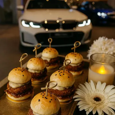 Our gourmet mini sliders are a perfect example of classic comfort food elevated for a luxury event. Served on a golden tray at the BMW 2 Series launch, they were both delicious and visually appealing.